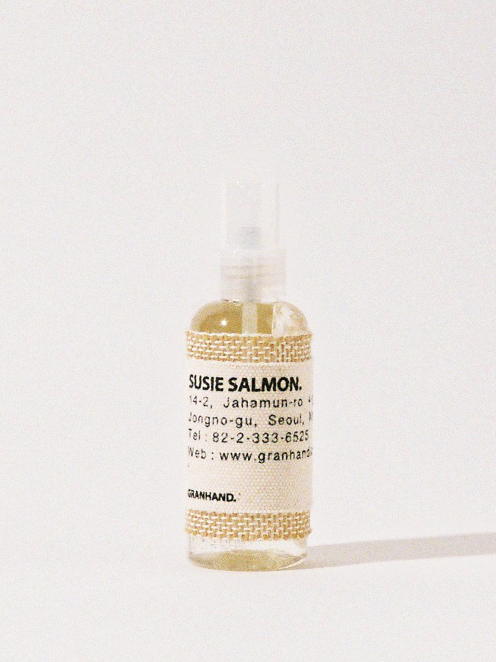 GRANHAND Susie Salmon Multi Perfume bottle with a fabric label