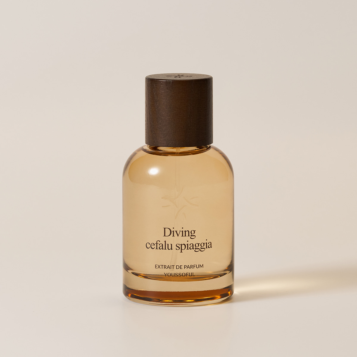 YOUSSOFUL Diving Cefalu Spiaggia Extrait de Parfum bottle with a dark wood cap