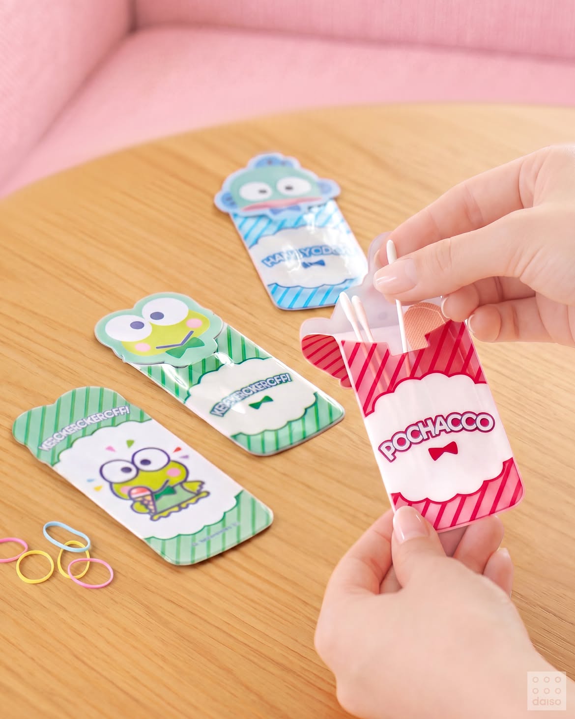 Official Daiso photograph of Pochacco, Kerokerokeroppi and Hangyodon multipurpose cases holding small daily essentials.