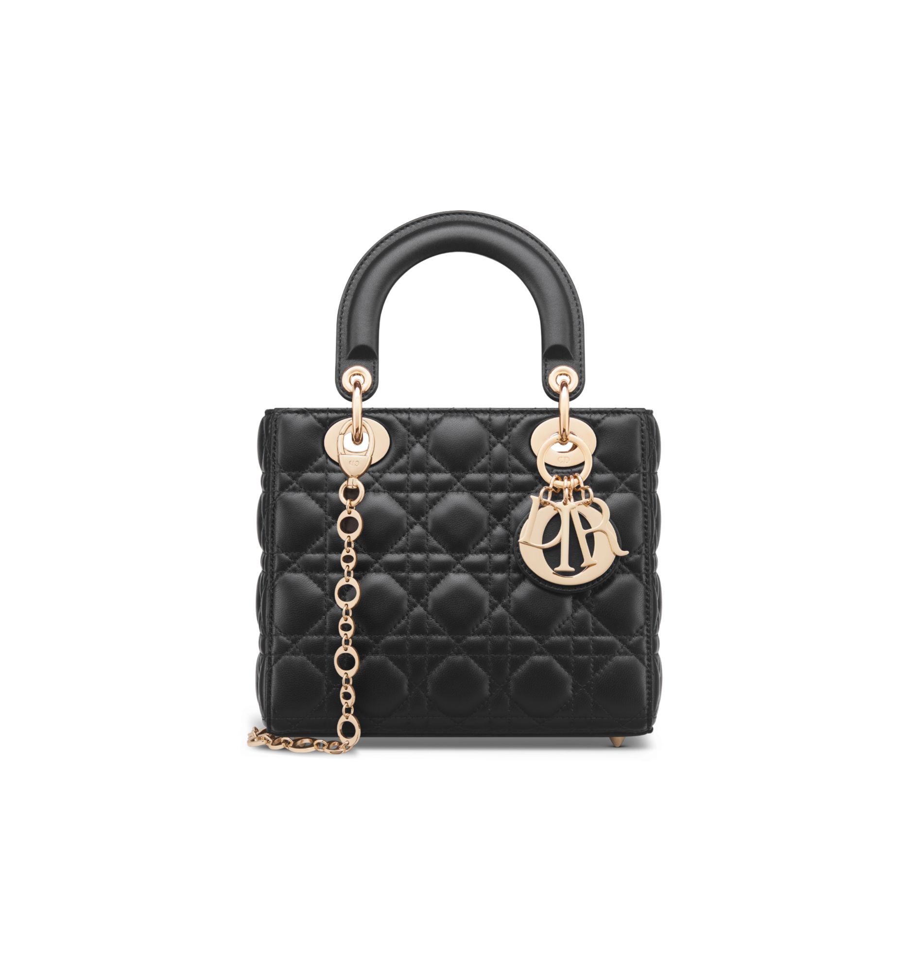 Official Dior photograph of the Small Lady Dior bag in black Cannage lambskin with pale gold-tone D.I.O.R. charms and a chain strap.